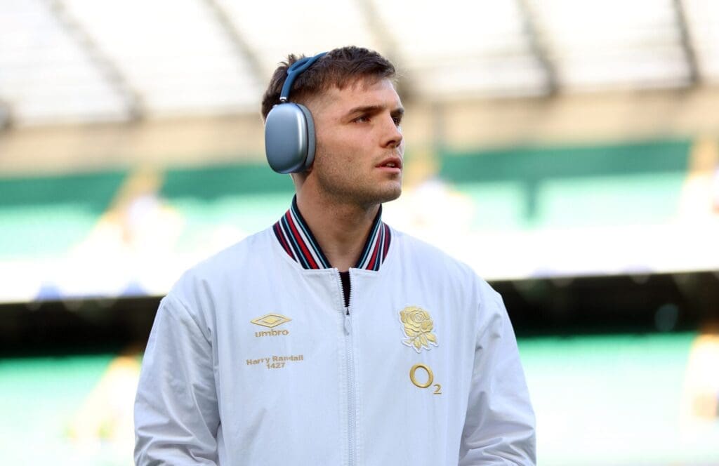 Harry Randall wearing headphones before a rugby match.