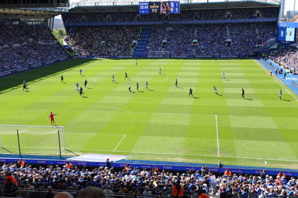 Action shot of a football game in progress with players competing on the field.