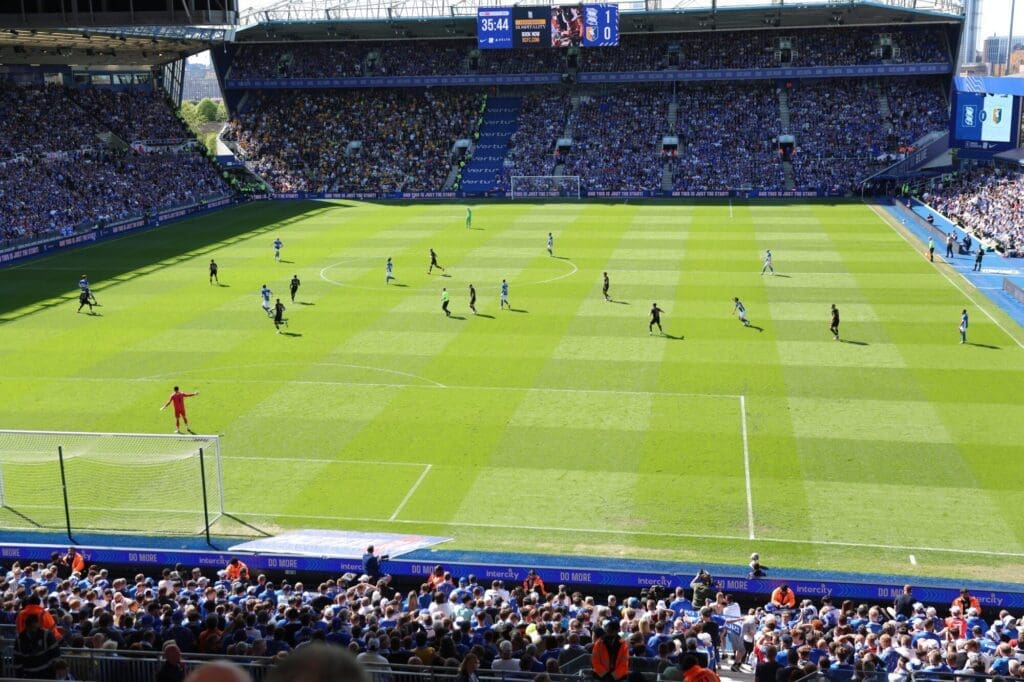 Action shot of a football game in progress with players competing on the field.