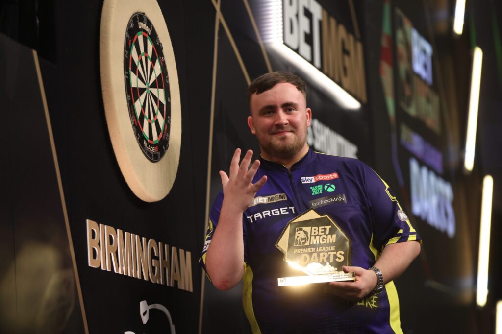 A dart player celebrating victory at the Premier League Darts event in Birmingham.