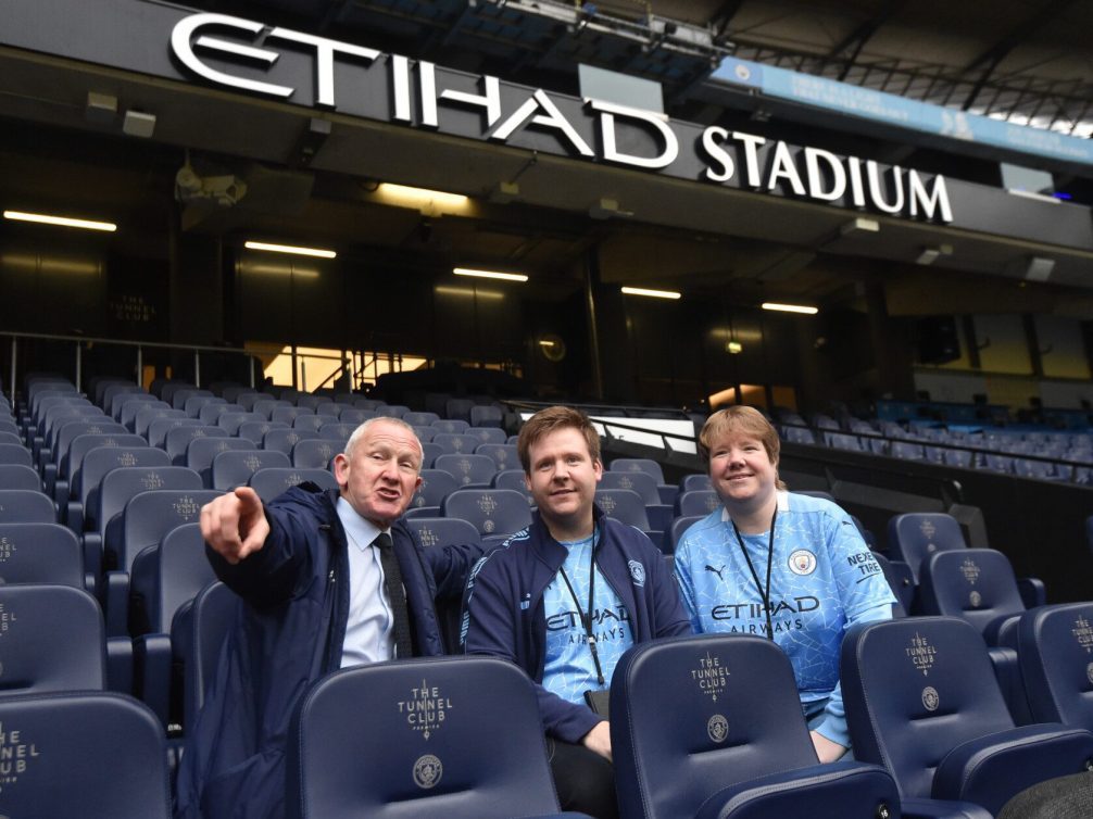 Interior view of Etihad Stadium with fans in the Tunnel Club section.