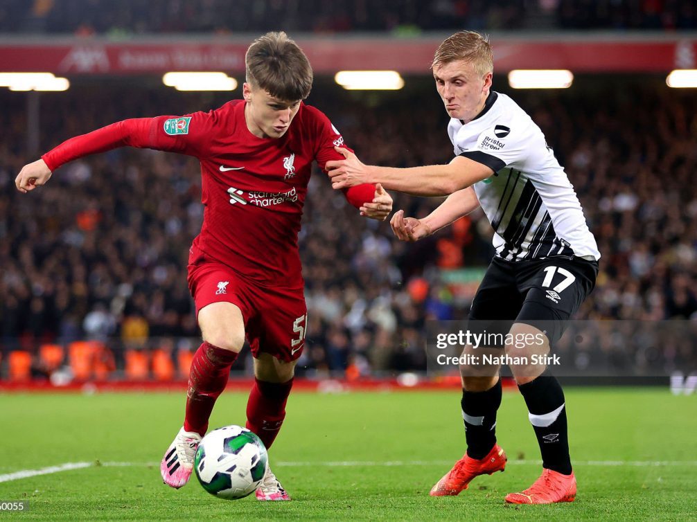 LIVERPOOL, ENGLAND - NOVEMBER 09: Ben Doak of Liverpool is challenged by Louie Sibley of Derby County during the Carabao Cup Third Round match between Liverpool and Derby County at Anfield on November 09, 2022 in Liverpool, England. (Photo by Nathan Stirk/Getty Images)