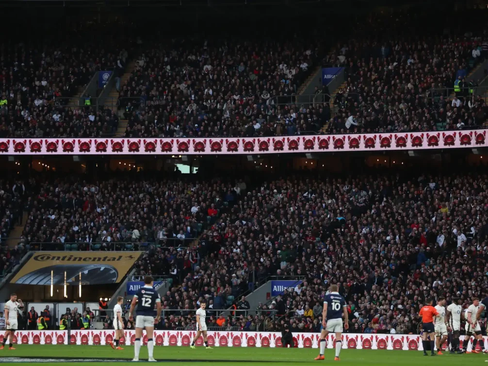 A packed crowd at Wembley Stadium during a rugby match.