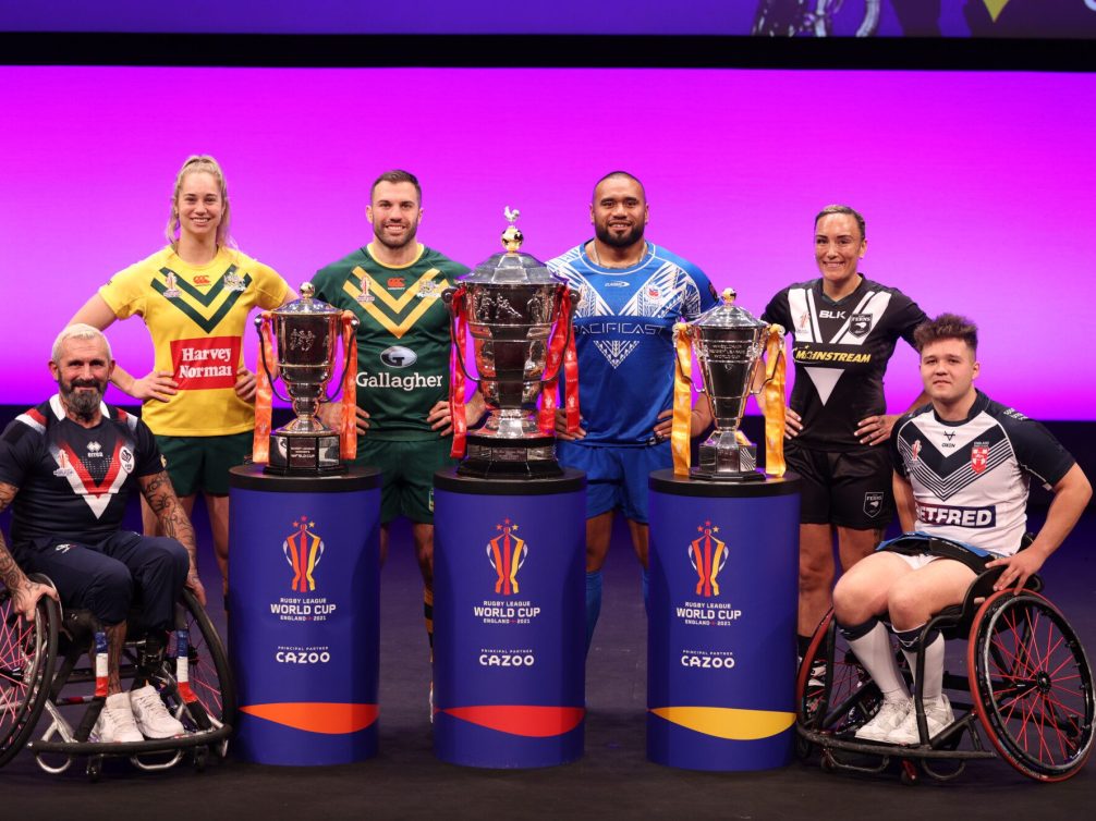 Rugby players showcasing their trophies during the Rugby League World Cup 2023.
