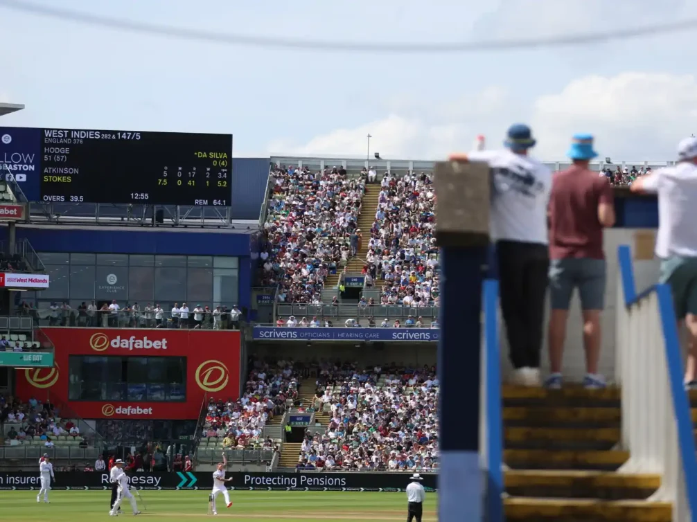 A cricket match featuring West Indies at Edgbaston, Birmingham with spectators in the background.